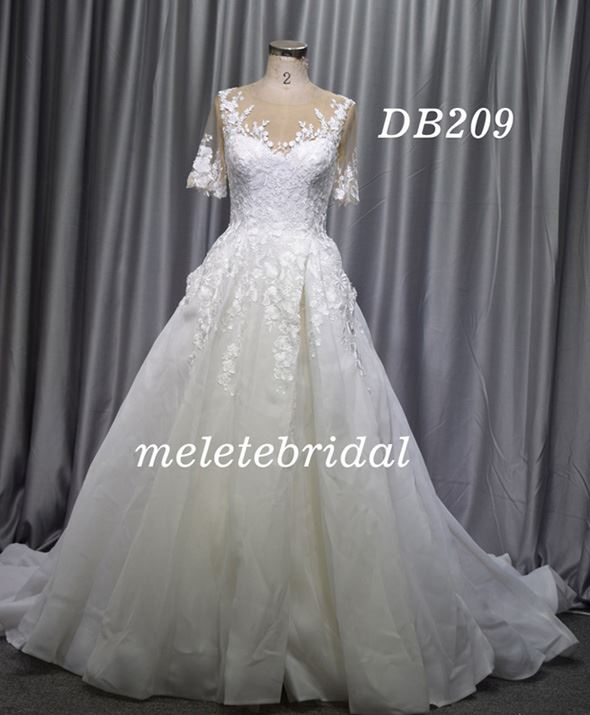 Short sleeves skin color tulle ivory organza wedding dress with a split in the front