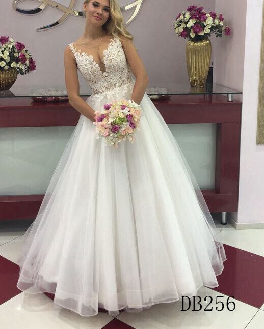 A line lace bridal dress with straps and whole sell wedding gown