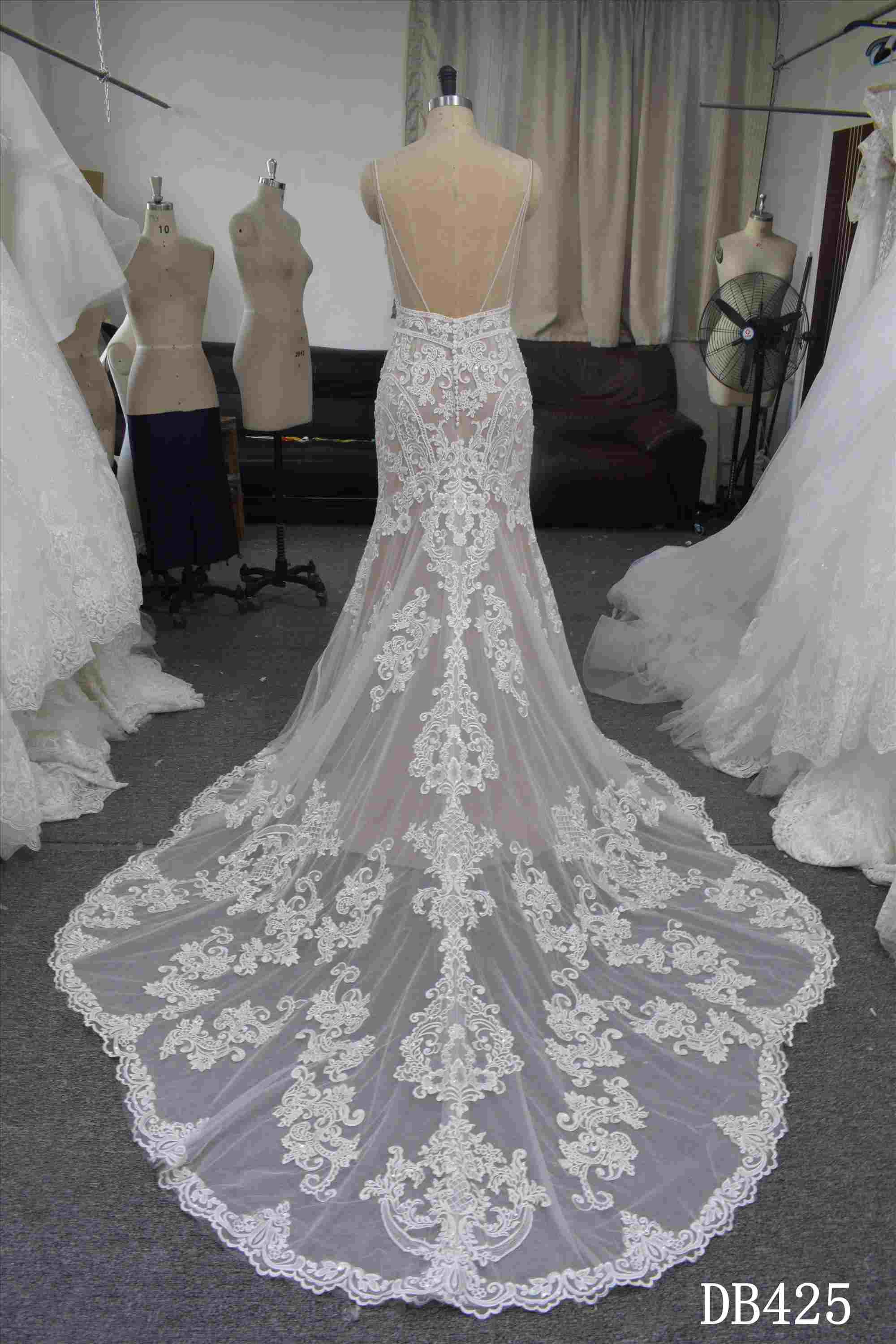 Nude color mermaid bridal gown with spaghetti straps