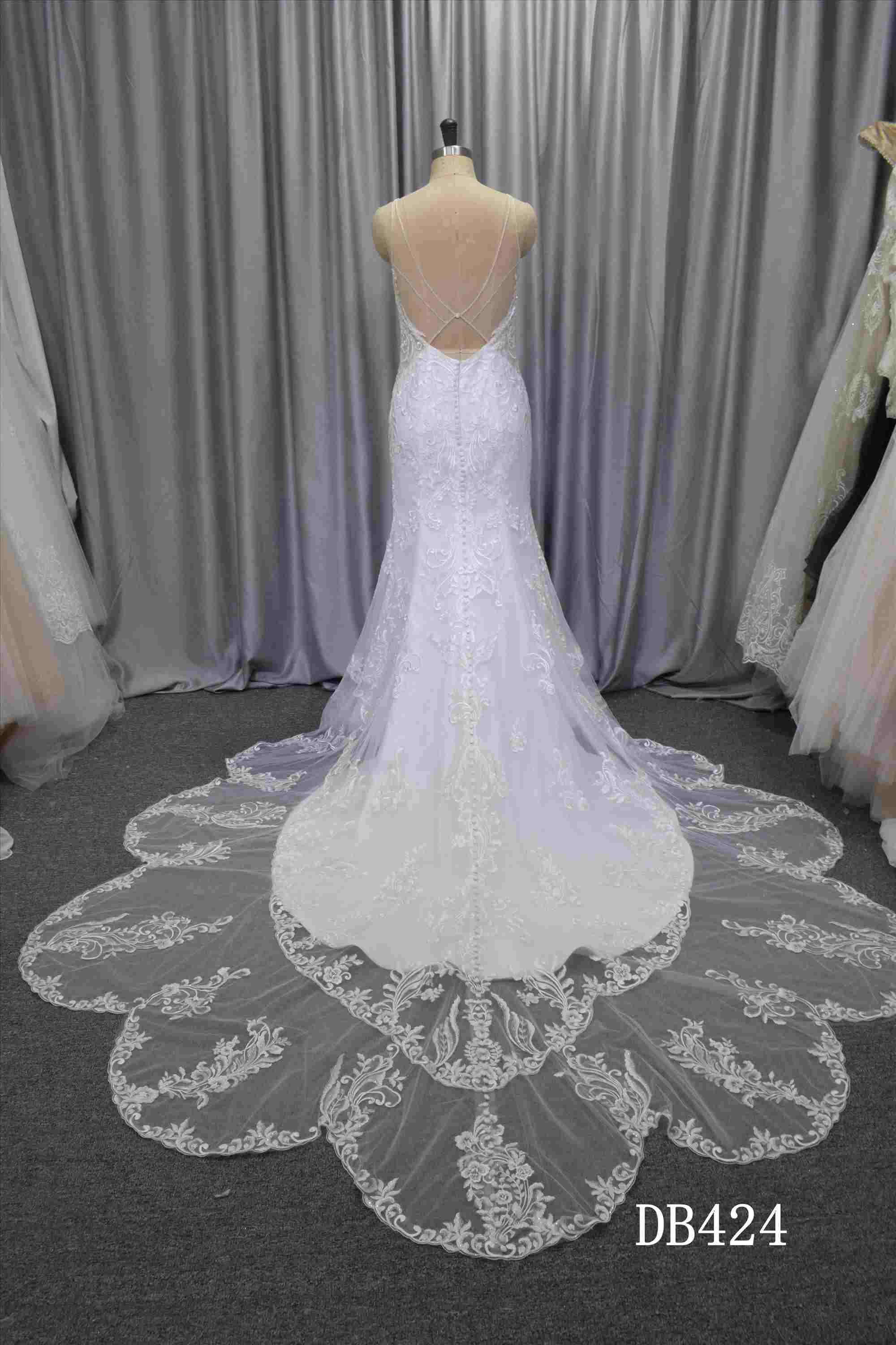 Illusion back wedding dress with curvy train