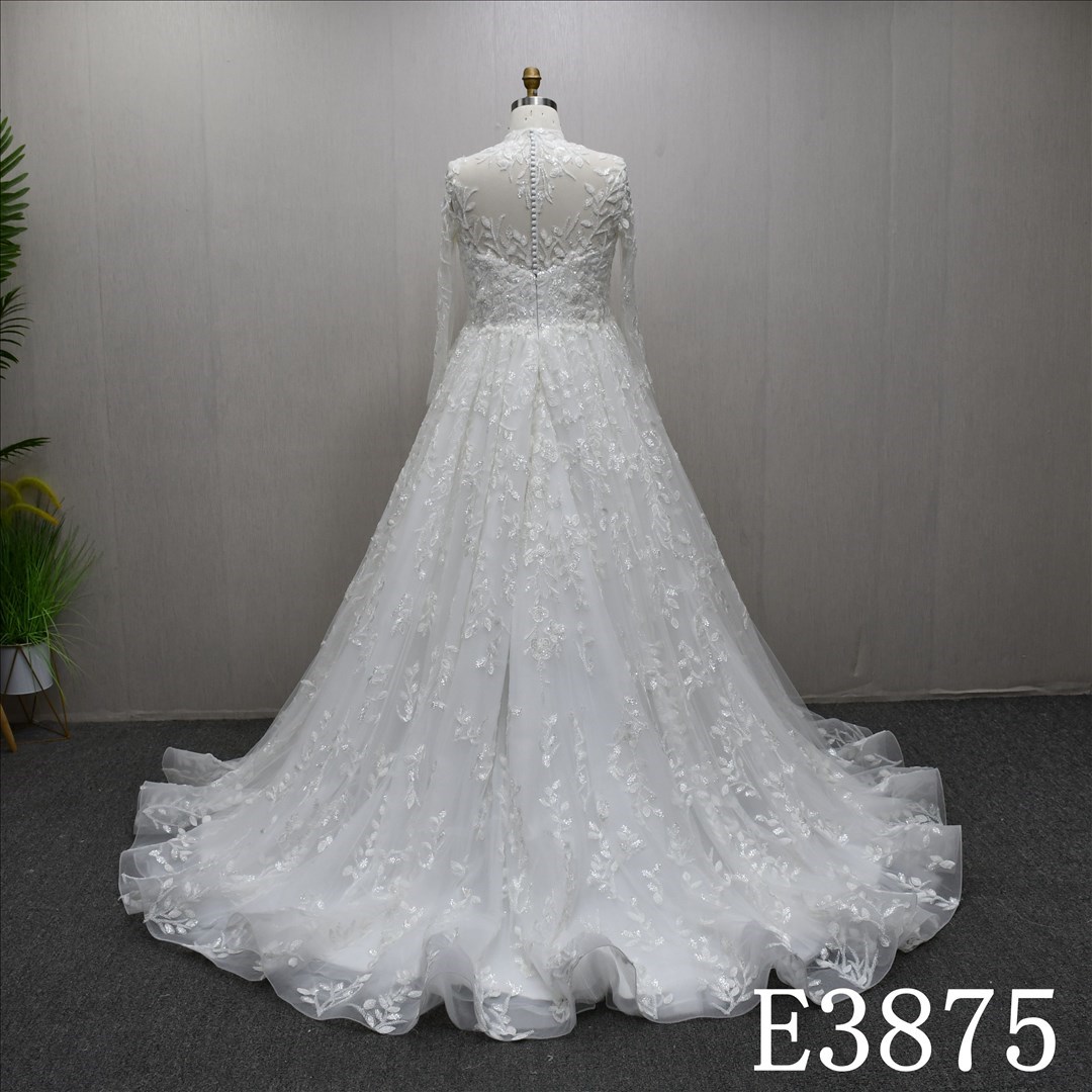 A-line wedding dress with high neck, long sleeves, appliqués, beads, and sequins