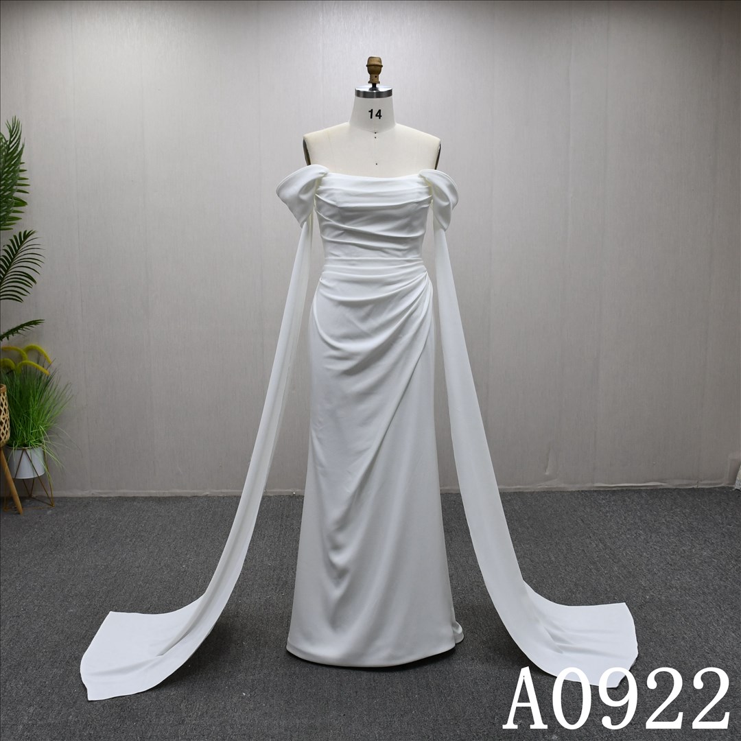 Mermaid wedding dress with off-the-shoulder sleeves, minimalist design and pleated detailing