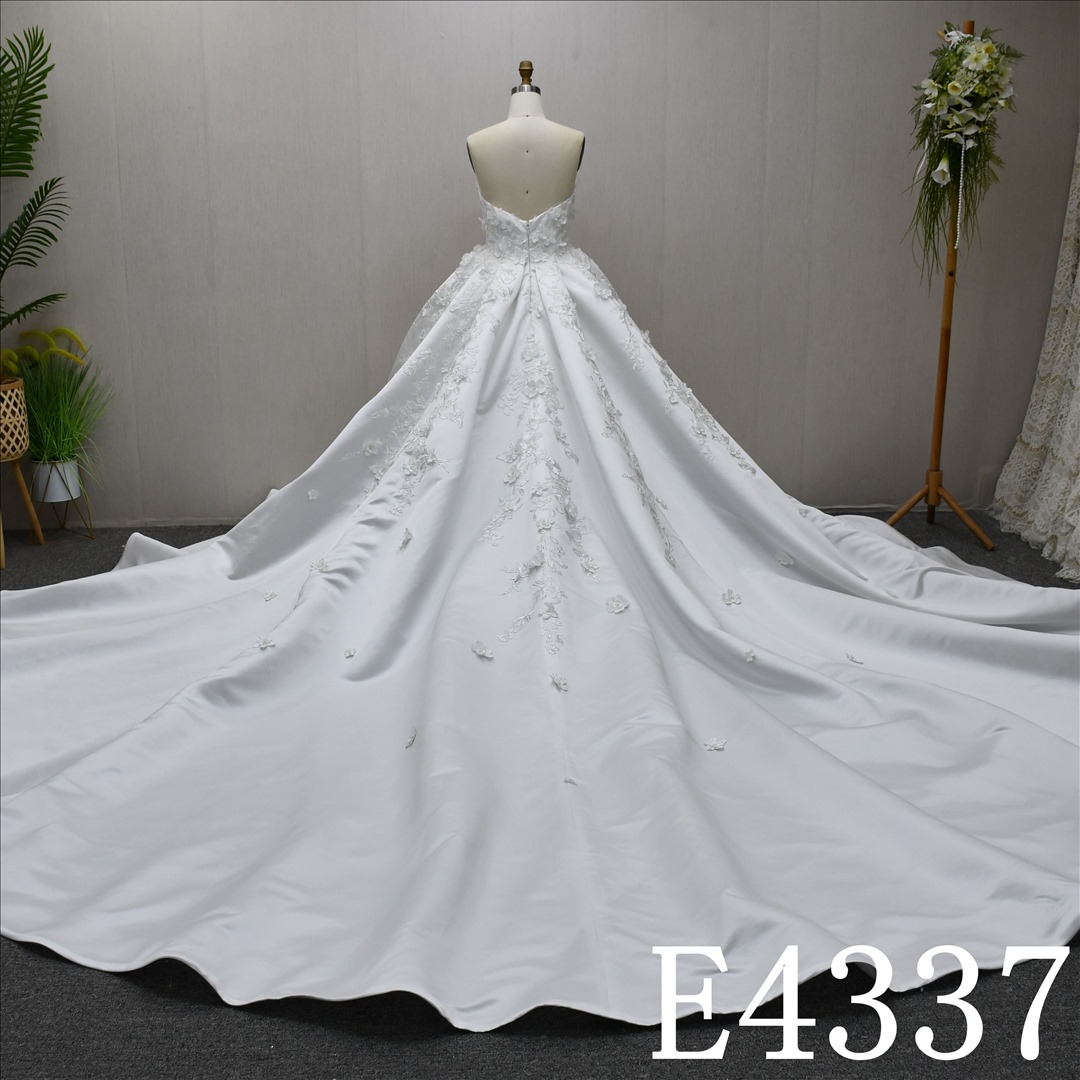 This Stain Ball Gown Boatneckline dress features Big Train design with Lace flower