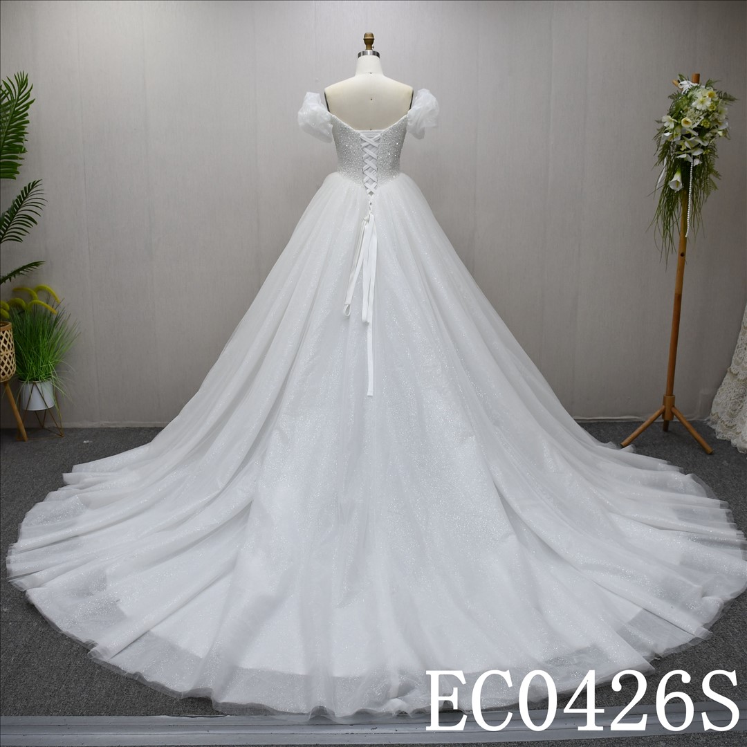 This Tulle Ball Gown Sweetheart dress features a simple design with Beading