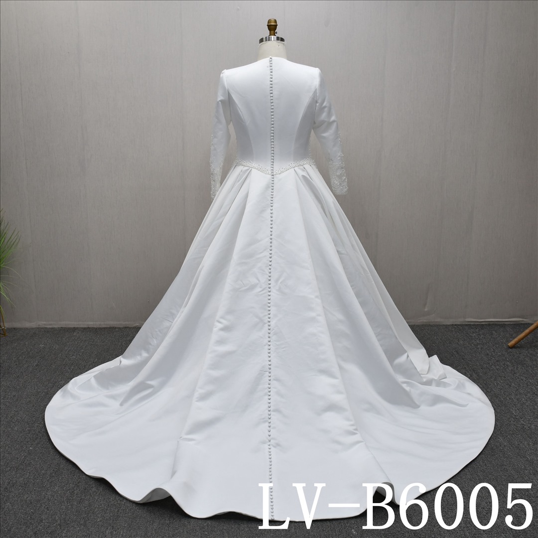 This Tulle Ball Gown Round Neck dress features a simple design with Beading