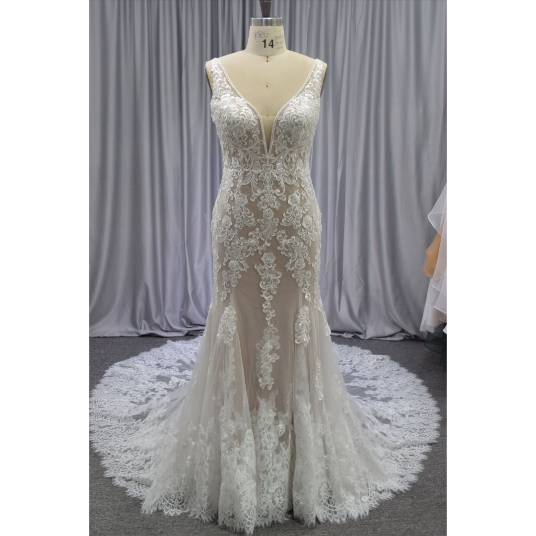 Gorgeous nude color lace mermaid gown with a beautiful train bridal dress