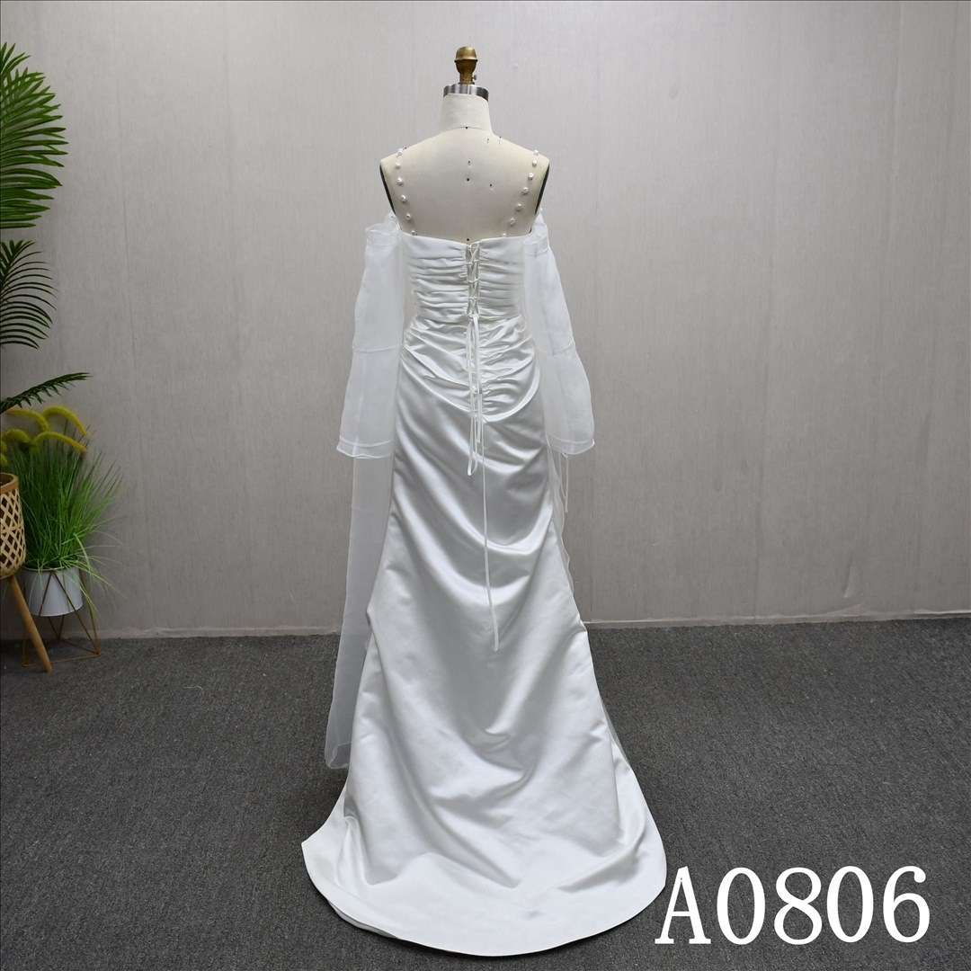 Beautiful white wedding evening dress with pearl straps