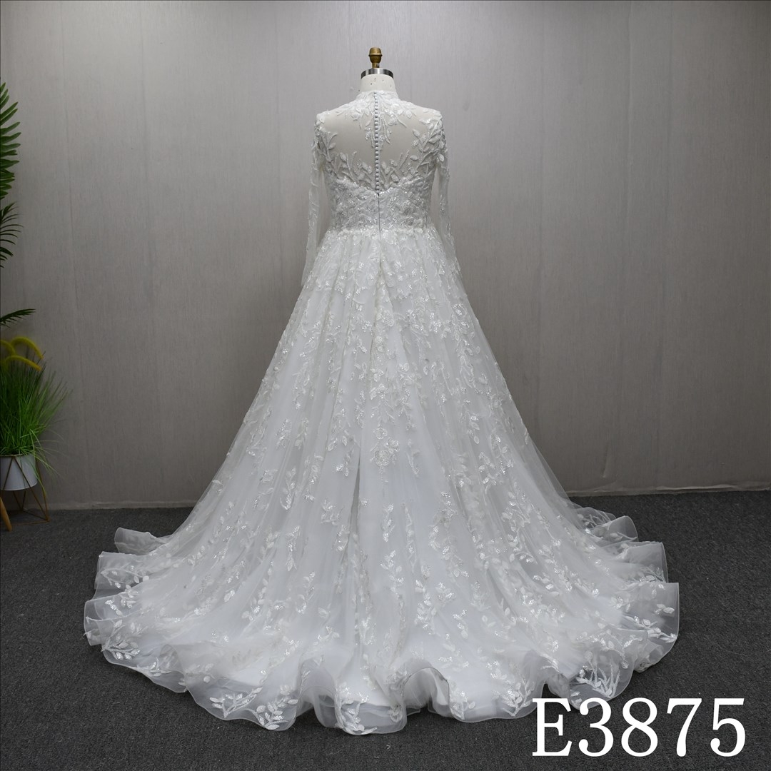A-line wedding dress with high neck, long sleeves, appliqués, beads, and sequins
