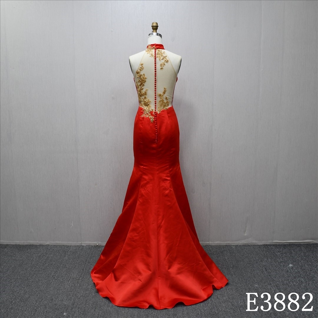 Elegant red fishtail evening dress with halter neckline and 3D flower decoration on the back