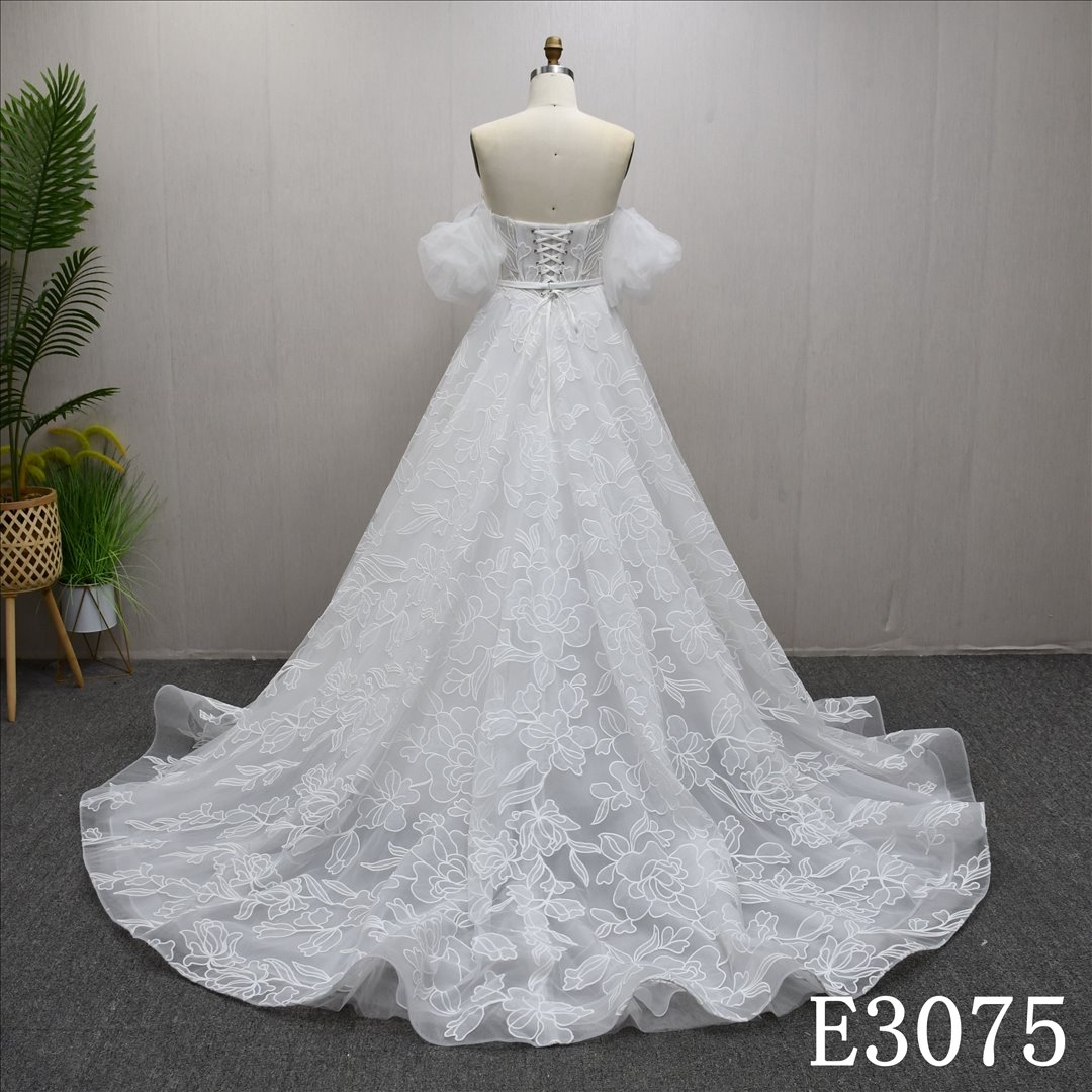 Beautiful ivory A-line wedding evening dress, off shoulder, with lace flowers all over
