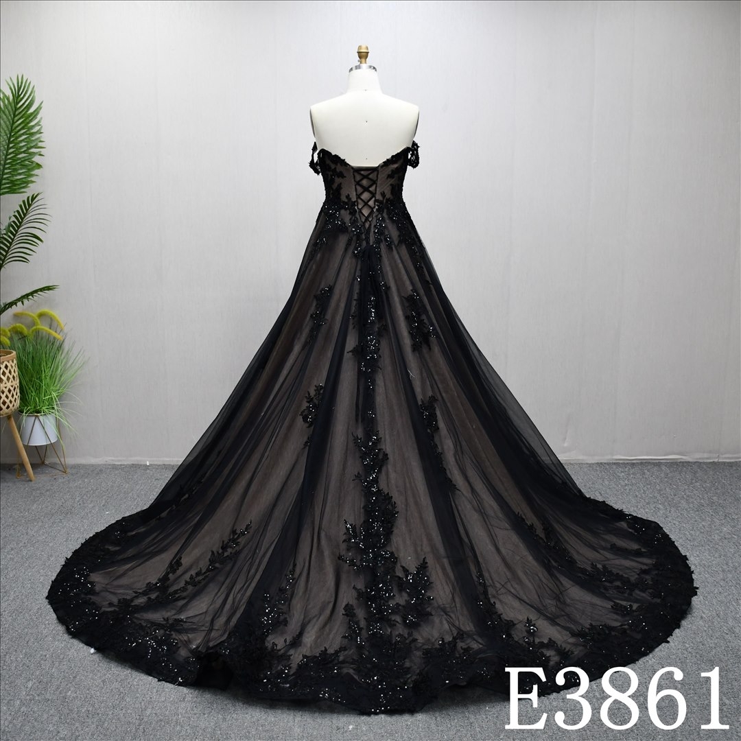 A-line black and nude wedding dress with bare sleeves and simple design