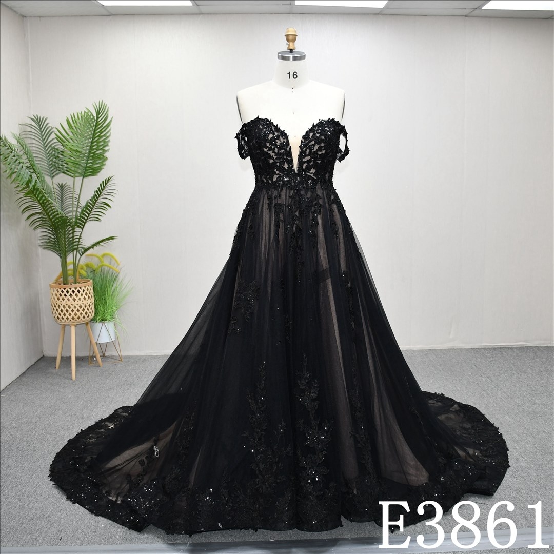 A-line black and nude wedding dress with bare sleeves and simple design