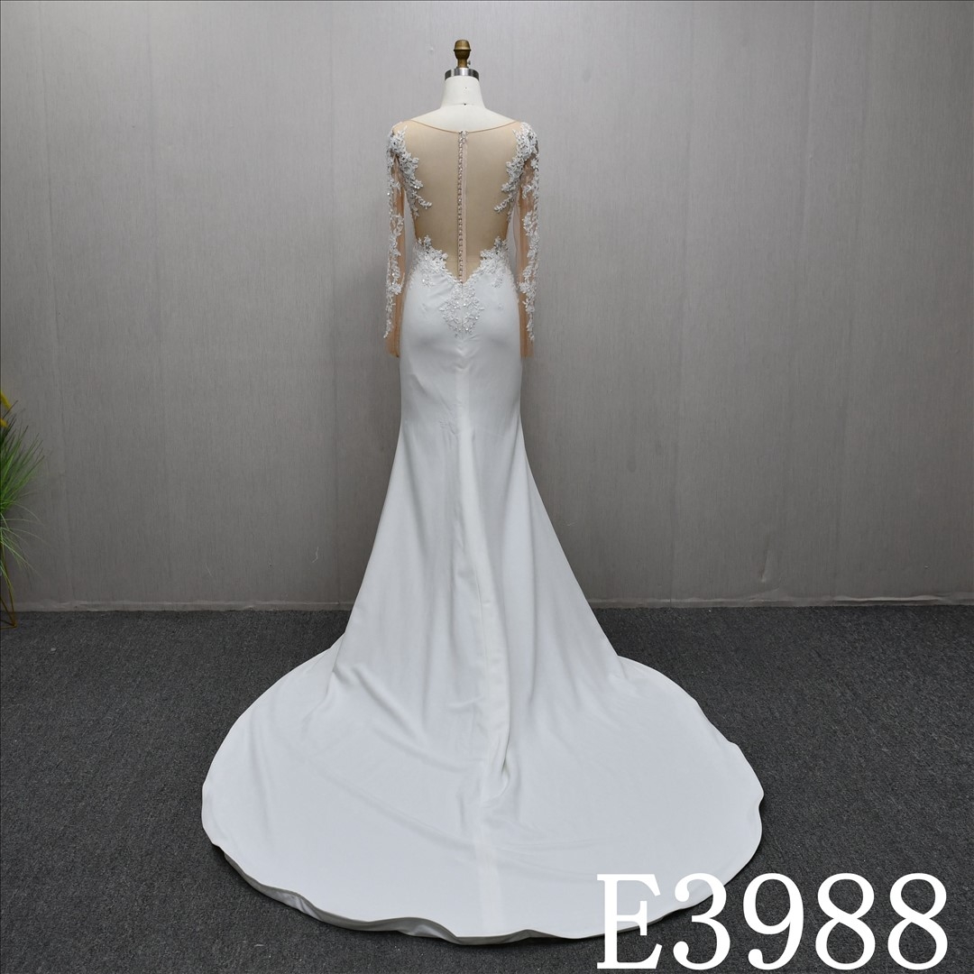 A stunning Mermaid wedding dress embellished with lace, sequins, and beads