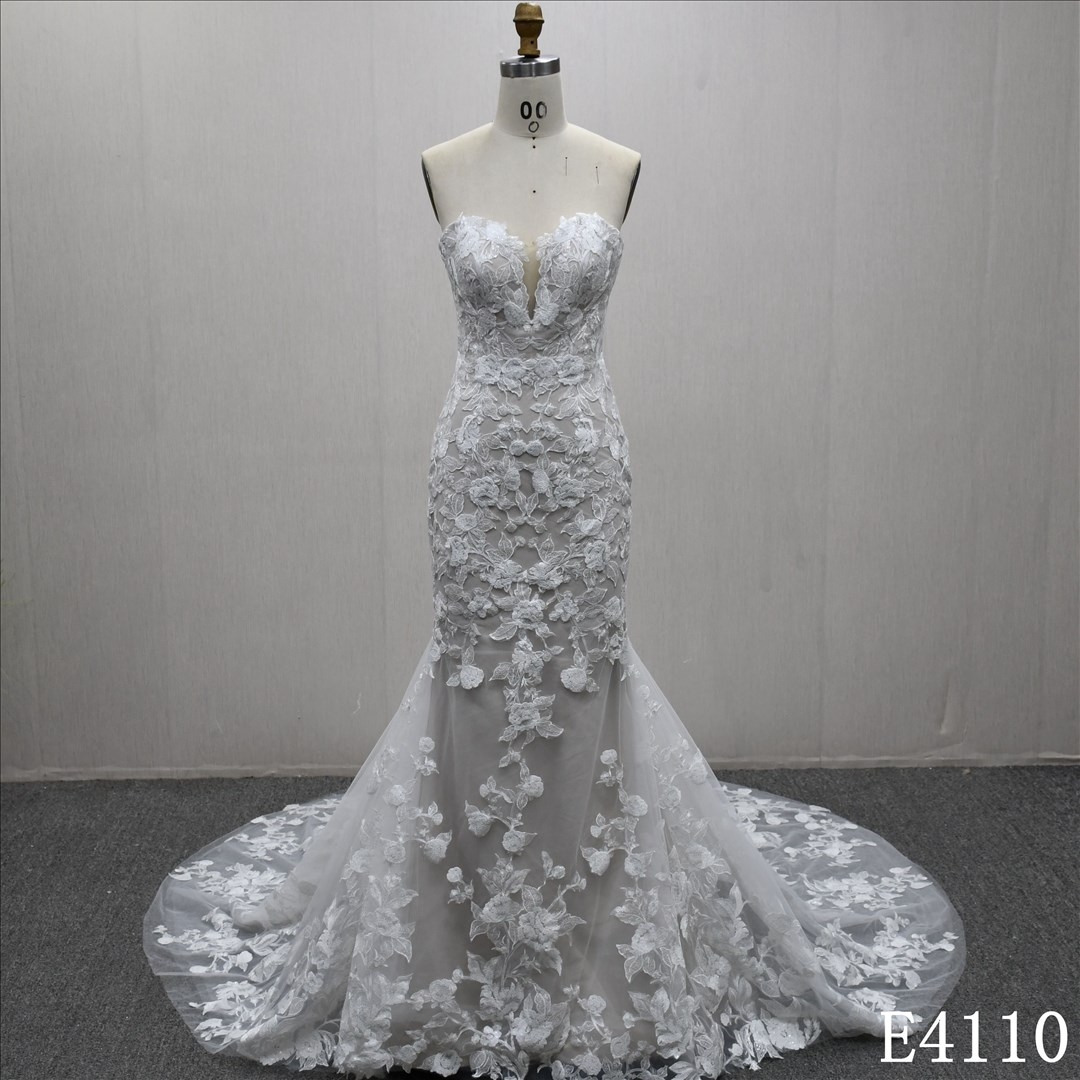 Mermaid wedding gown with a unique sweetheart neckline and full-body lace embellishments