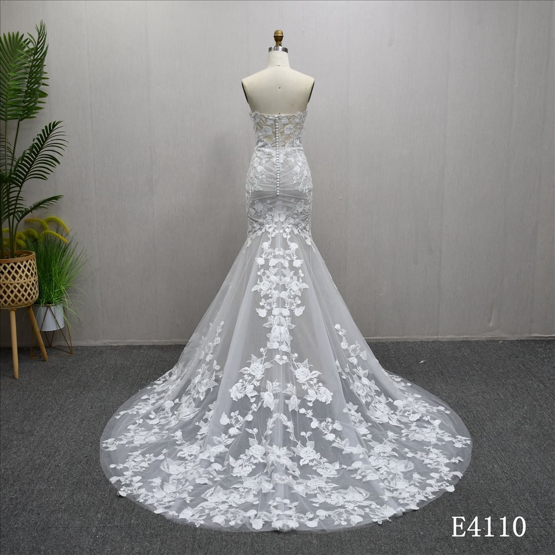 Mermaid wedding gown with a unique sweetheart neckline and full-body lace embellishments