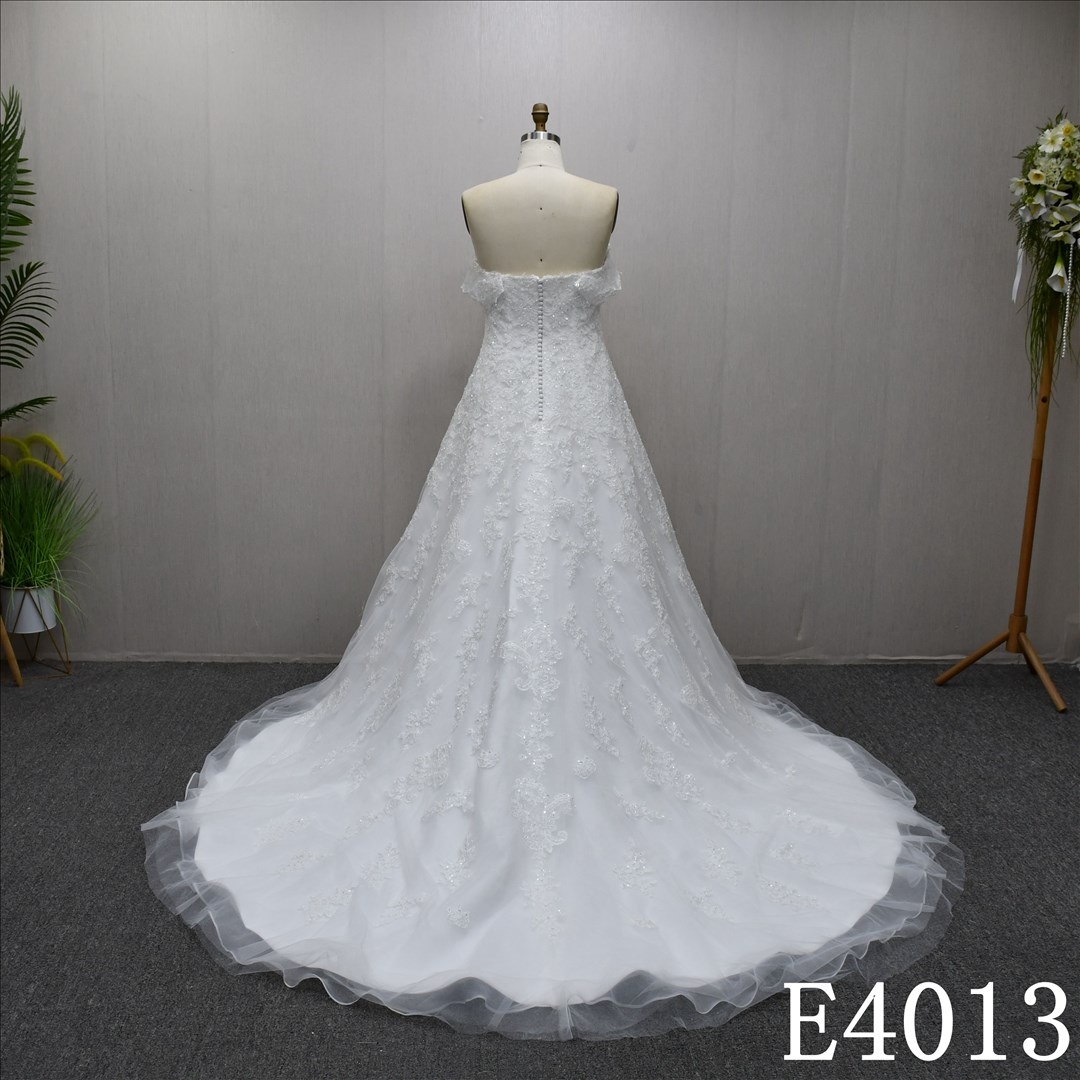Beautiful unique luxury A-line wedding evening dress with lace flowers and beading and sequins all over