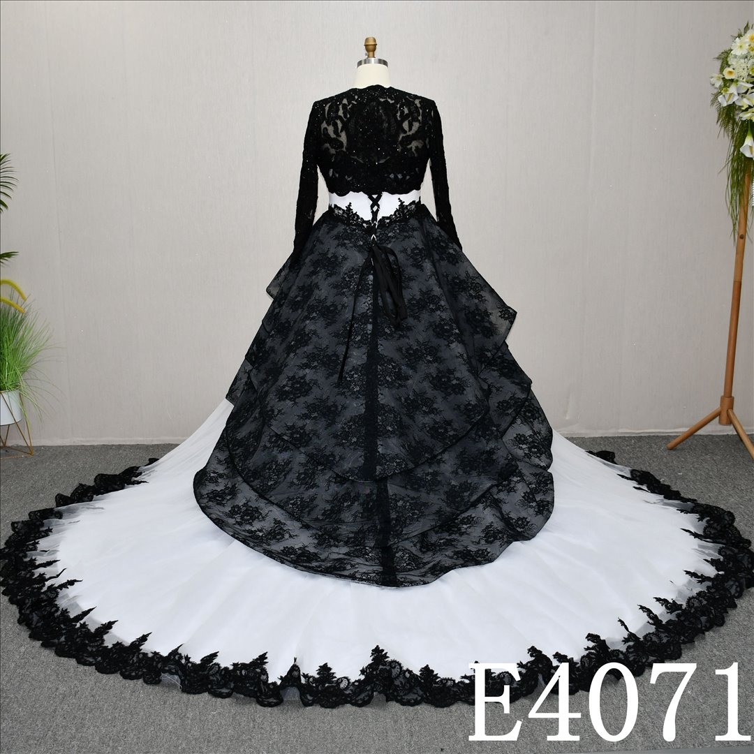 A unique A-line wedding dress in black and white, with a sweetheart neckline and intricate design