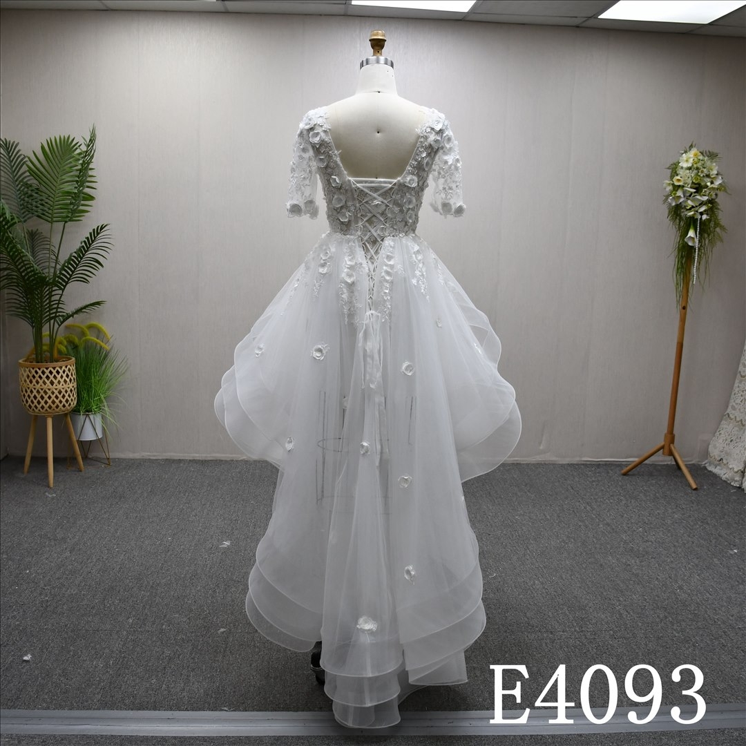 A-line minimalist design, floor-length wedding dress, sweetheart neckline, short sleeves, lace flower details