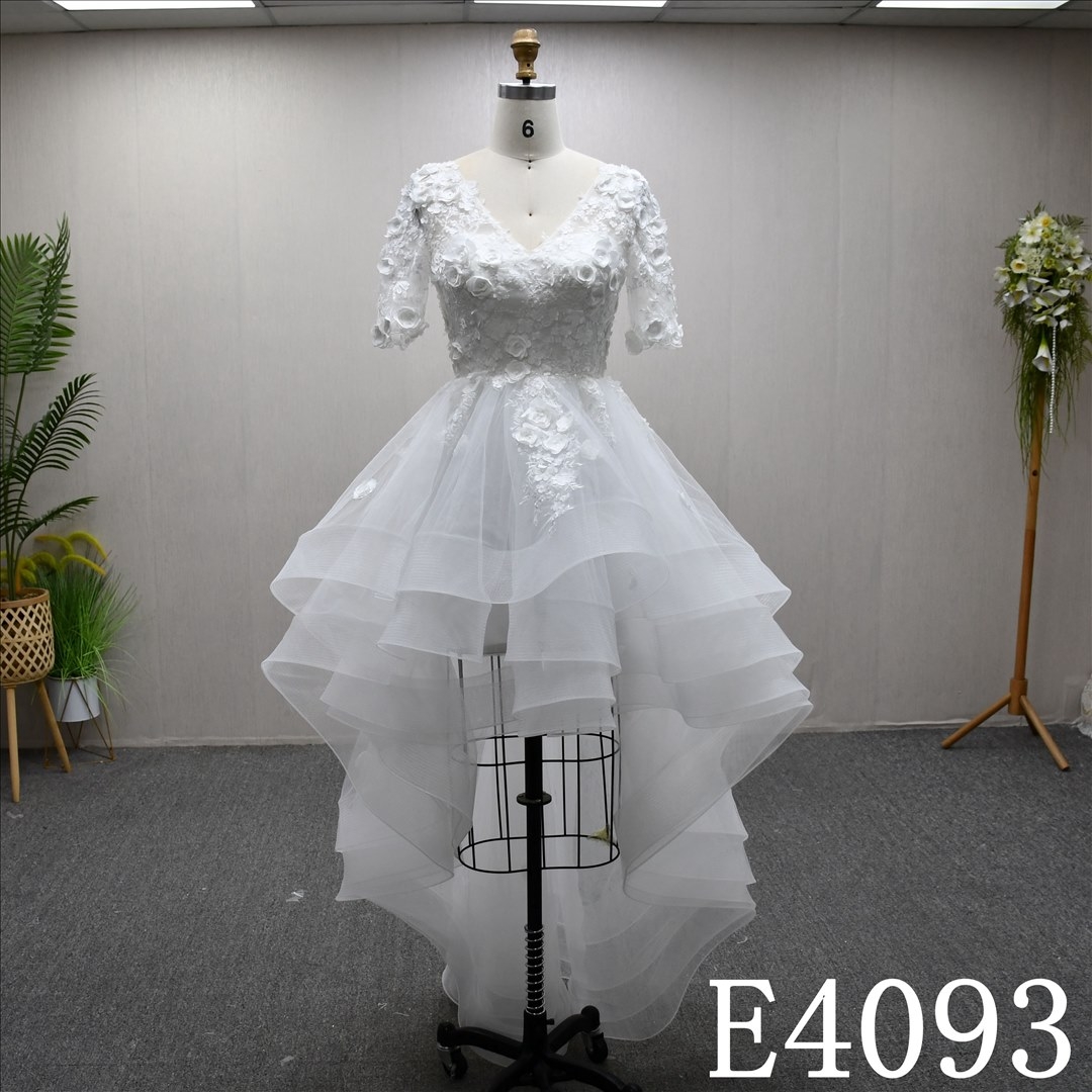 A-line minimalist design, floor-length wedding dress, sweetheart neckline, short sleeves, lace flower details