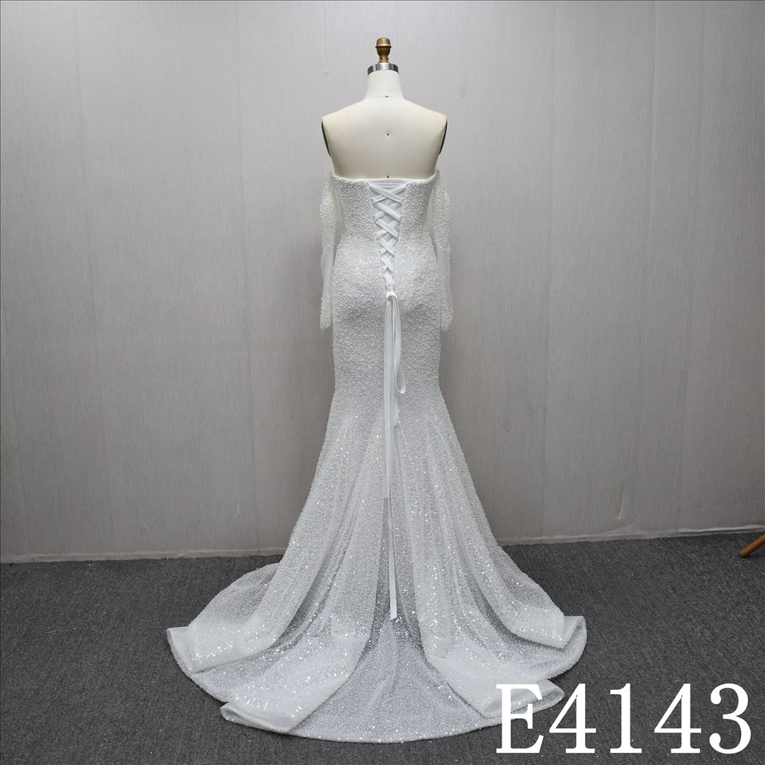 Unique and luxurious design, V-neck, pearl-embellished wedding dress with a detachable train