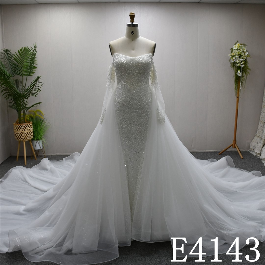 Unique and luxurious design, V-neck, pearl-embellished wedding dress with a detachable train