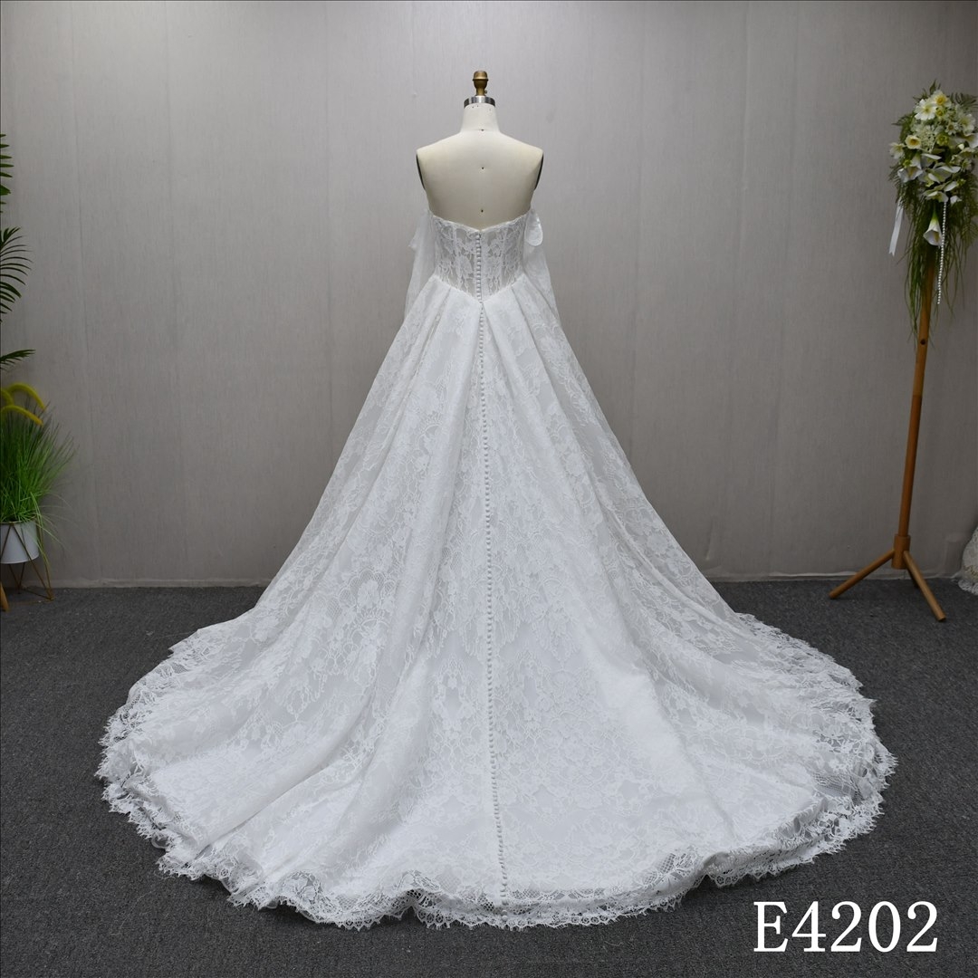 This best-selling A-line dress features a unique design with all-over lace and a lace-up back.