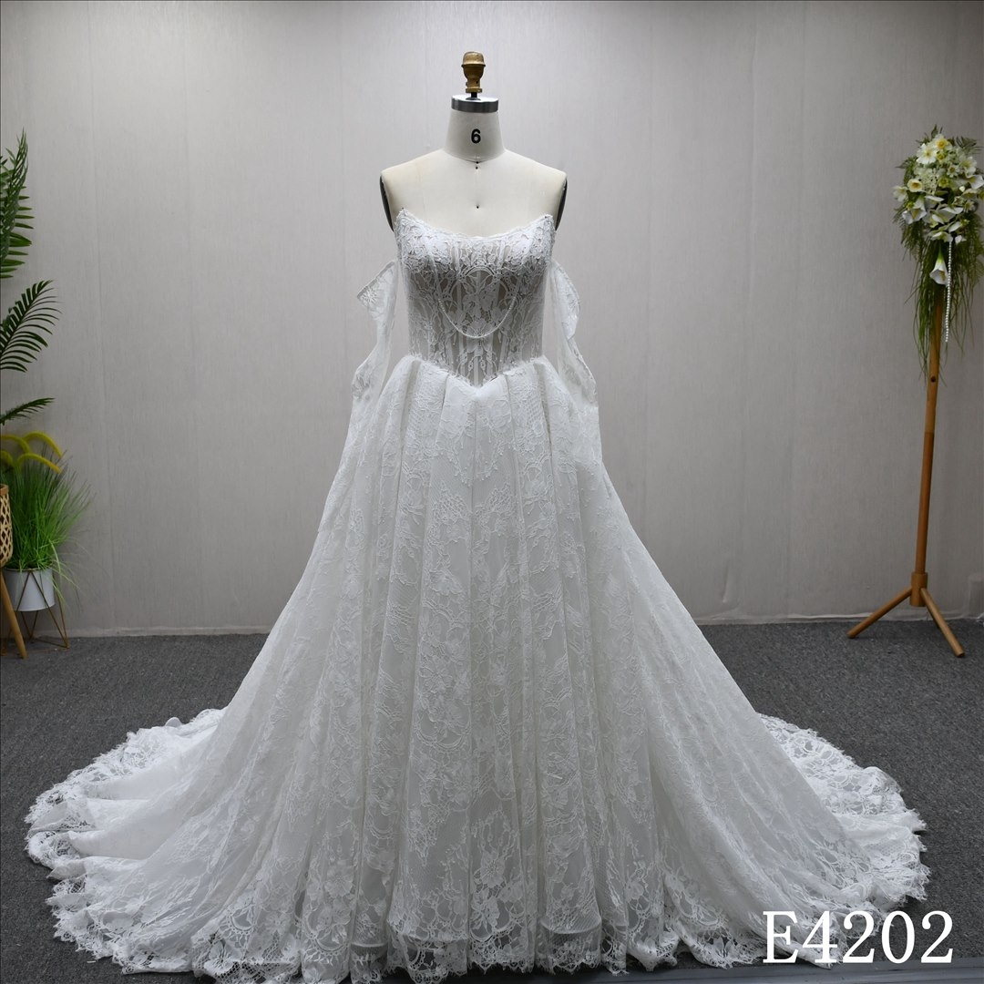 This best-selling A-line dress features a unique design with all-over lace and a lace-up back.