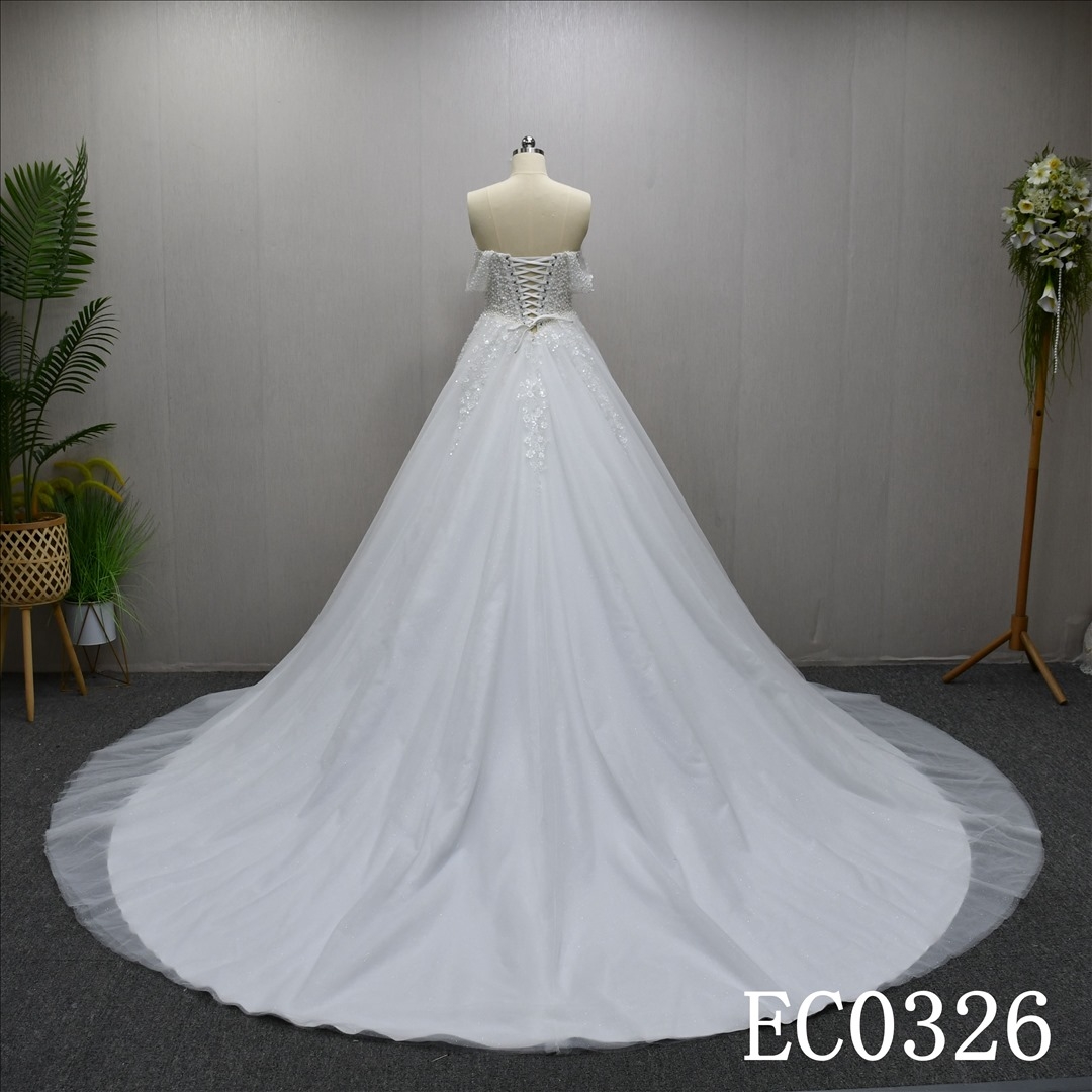 Beautiful unique luxury A-line wedding evening dress with lace flowers and beading and sequins
