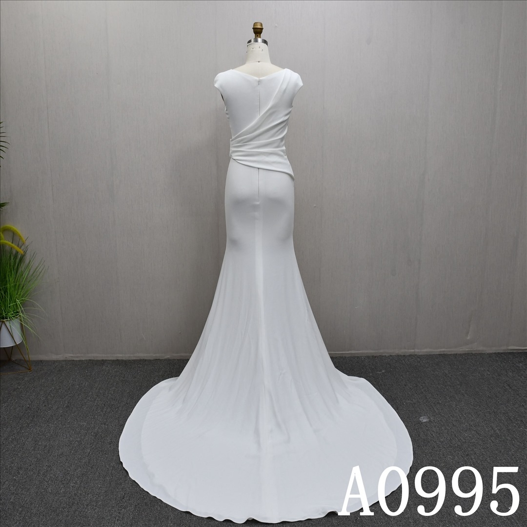 This best-selling Mermaid dress features a unique pleated design and a back zipper.