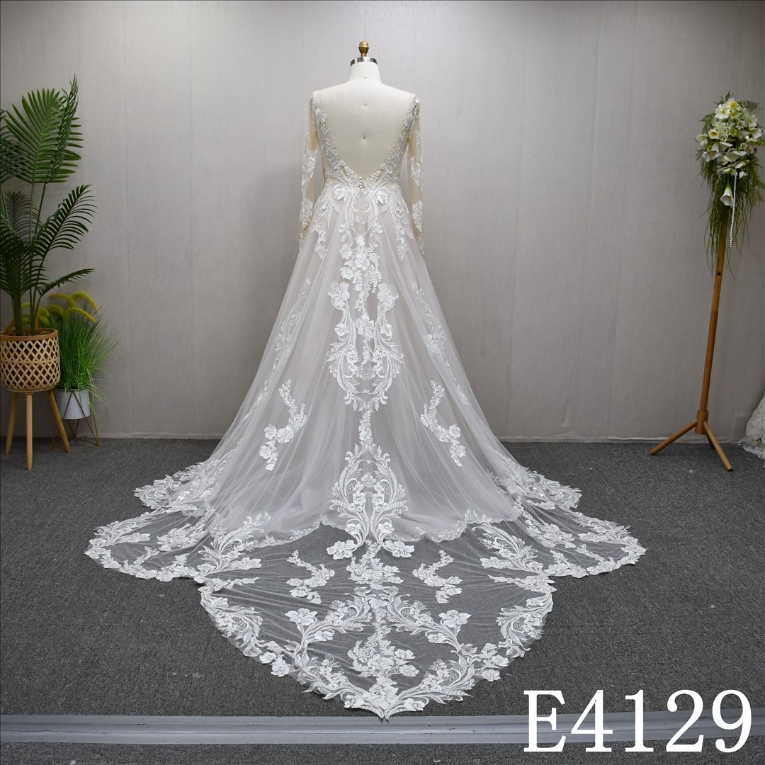 A uniquely designed and exquisite mermaid wedding evening gown adorned with lace.