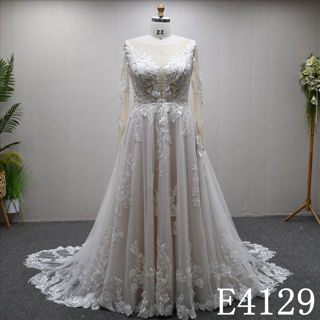 A uniquely designed and exquisite mermaid wedding evening gown adorned with lace.