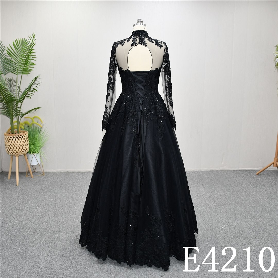 Unique A-line wedding dress in black, with a sweetheart neckline and intricate design
