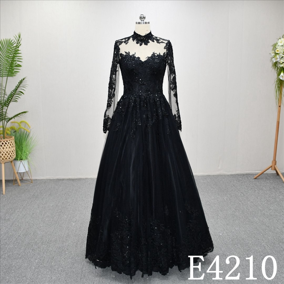 Unique A-line wedding dress in black, with a sweetheart neckline and intricate design