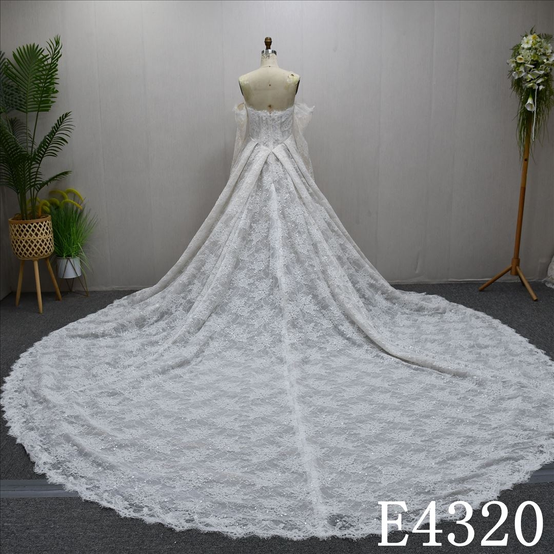 Lace and sequin design, long sleeves, sweetheart neckline, back zipper wedding dress