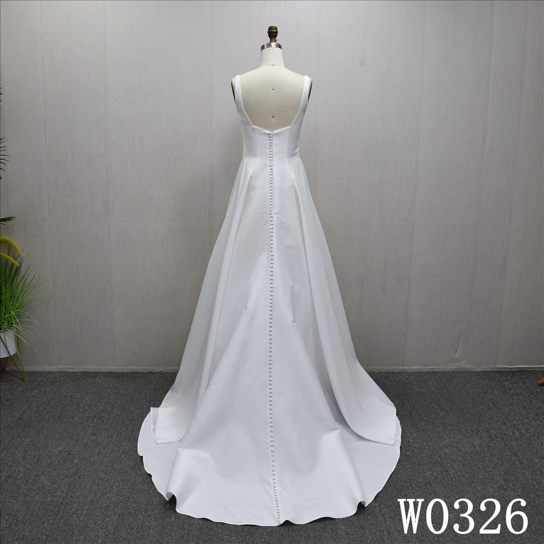 A beautiful A-line wedding evening gown with a simple pleats design