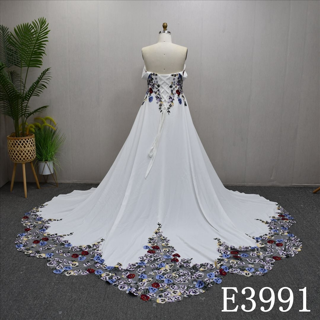 A gorgeous and unique Ivory and Colorful A-line wedding dress evening gown, adorned with lace flowers.