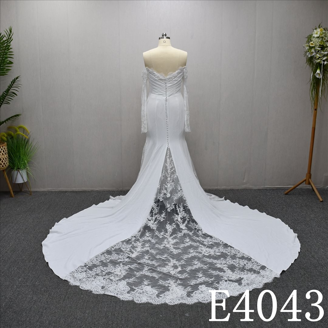 Mermaid wedding gown with a unique sweetheart neckline and lace embellishments