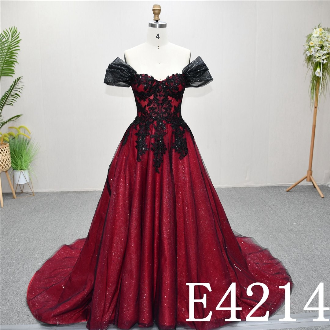 A unique A-line wedding dress in red and black, with a sweetheart neckline and intricate design