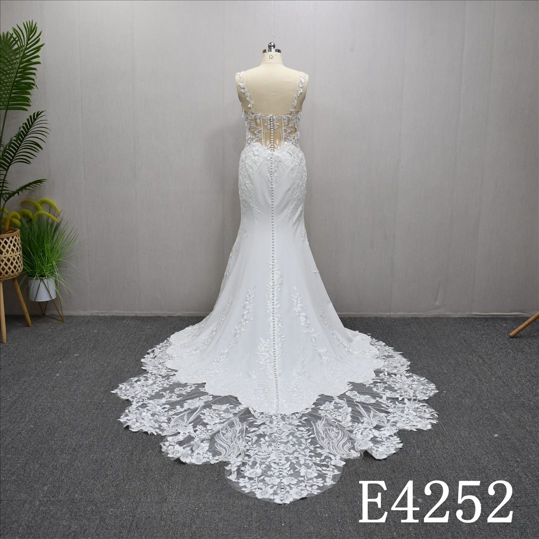 Mermaid wedding gown with a unique Sweetheart neckline and lace embellishments