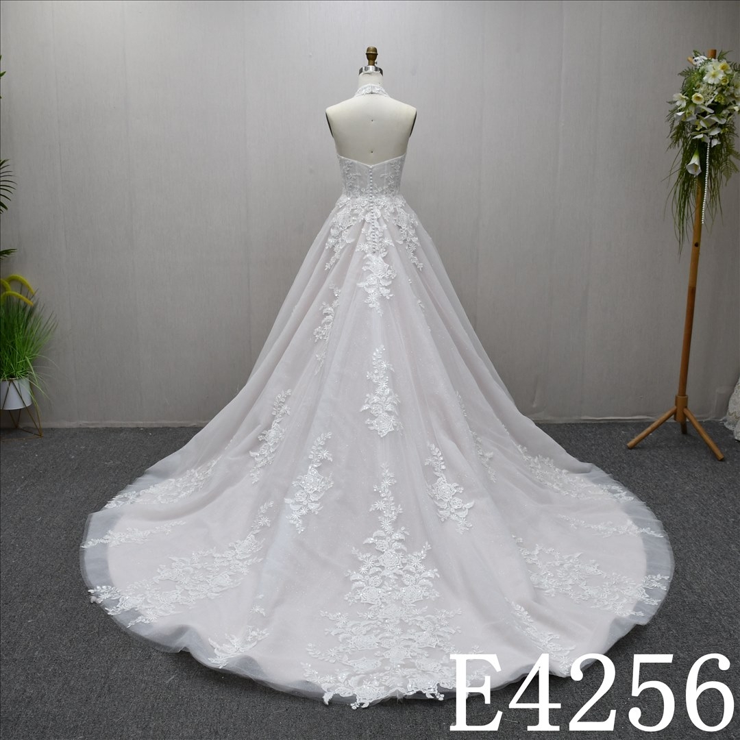 Elegant Sleeveless , minimalist design, lace A-line wedding dress with a back zipper and button.