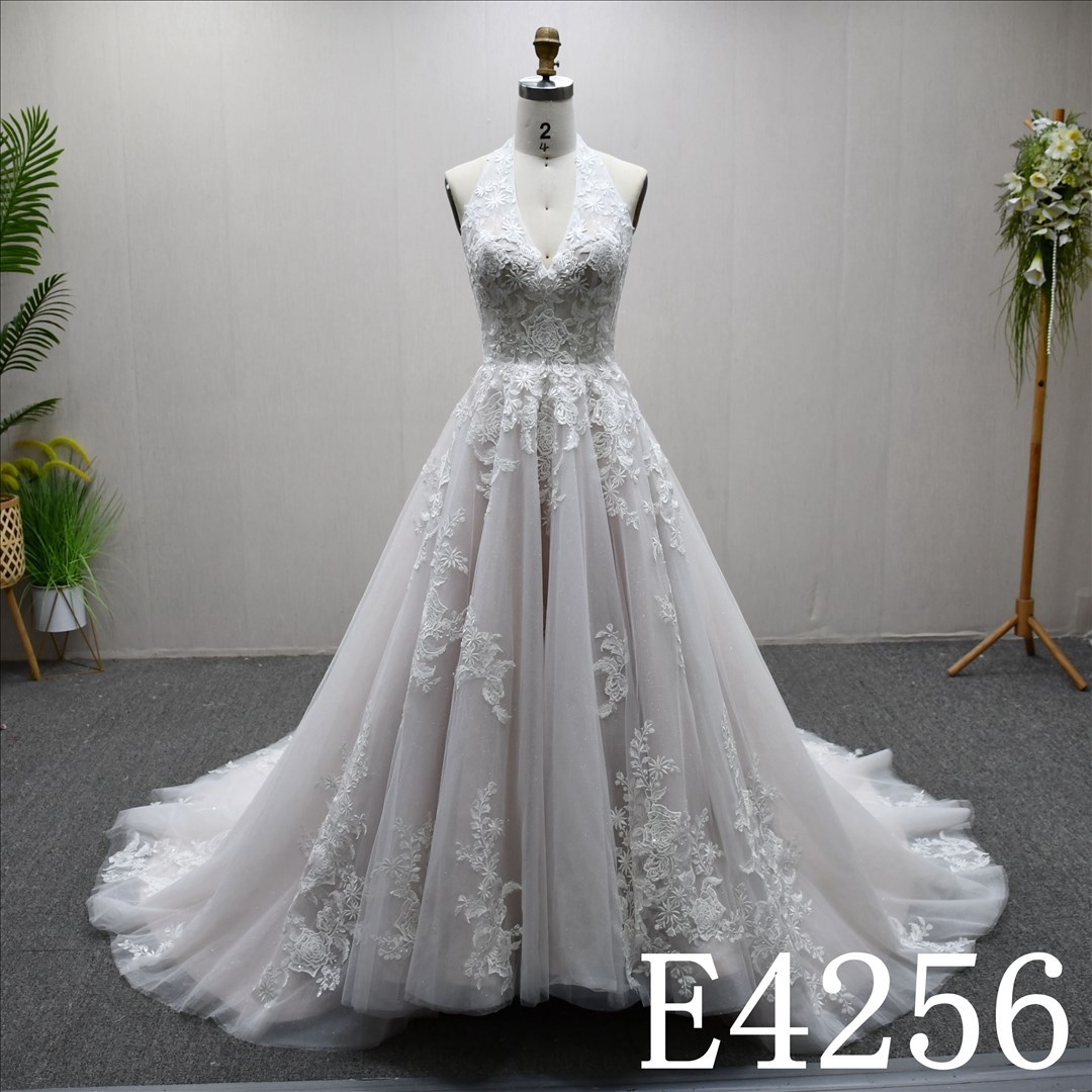 Elegant Sleeveless , minimalist design, lace A-line wedding dress with a back zipper and button.