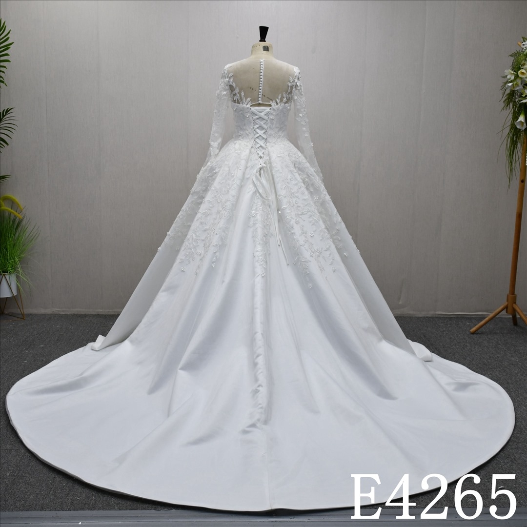 A beautiful A-line long sleeves wedding evening gown with a full body lace design