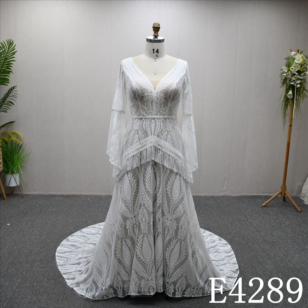 A unique and simple long-sleeved V-neck A-line wedding dress evening gown.