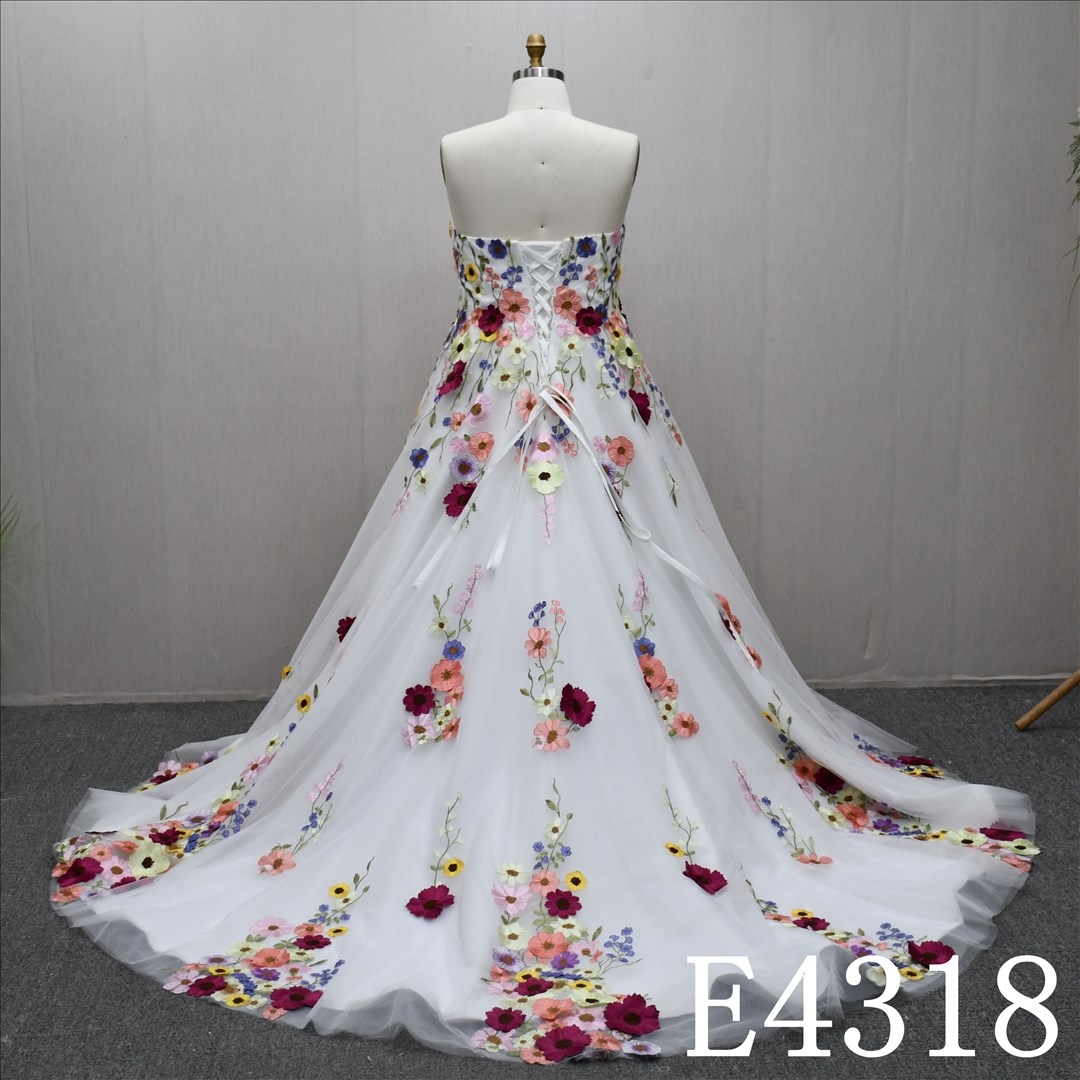 A gorgeous and unique Ivory and Colorful A-line wedding dress evening gown, adorned with lace flowers.
