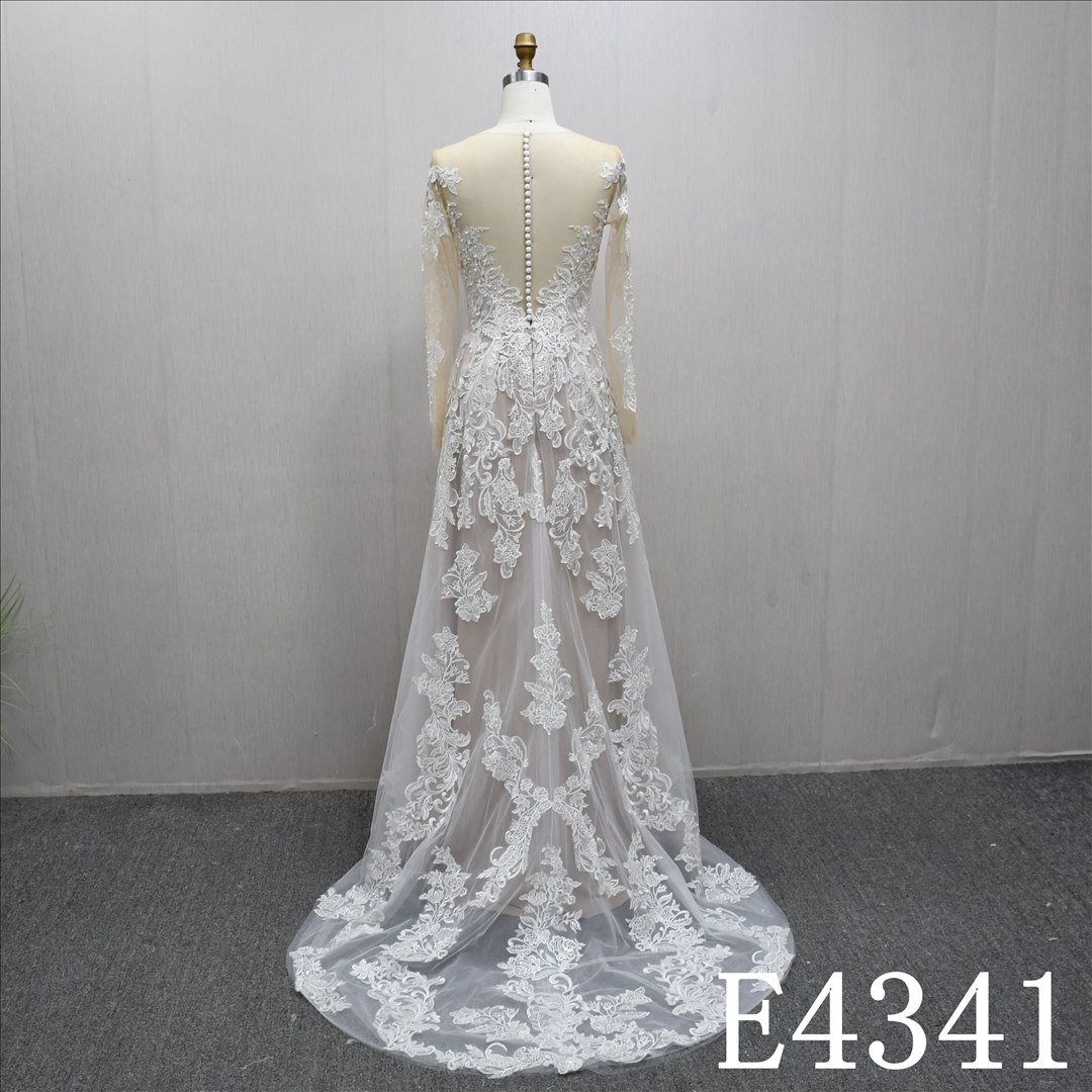 A beautiful A-line wedding evening gown with a full-body lace design
