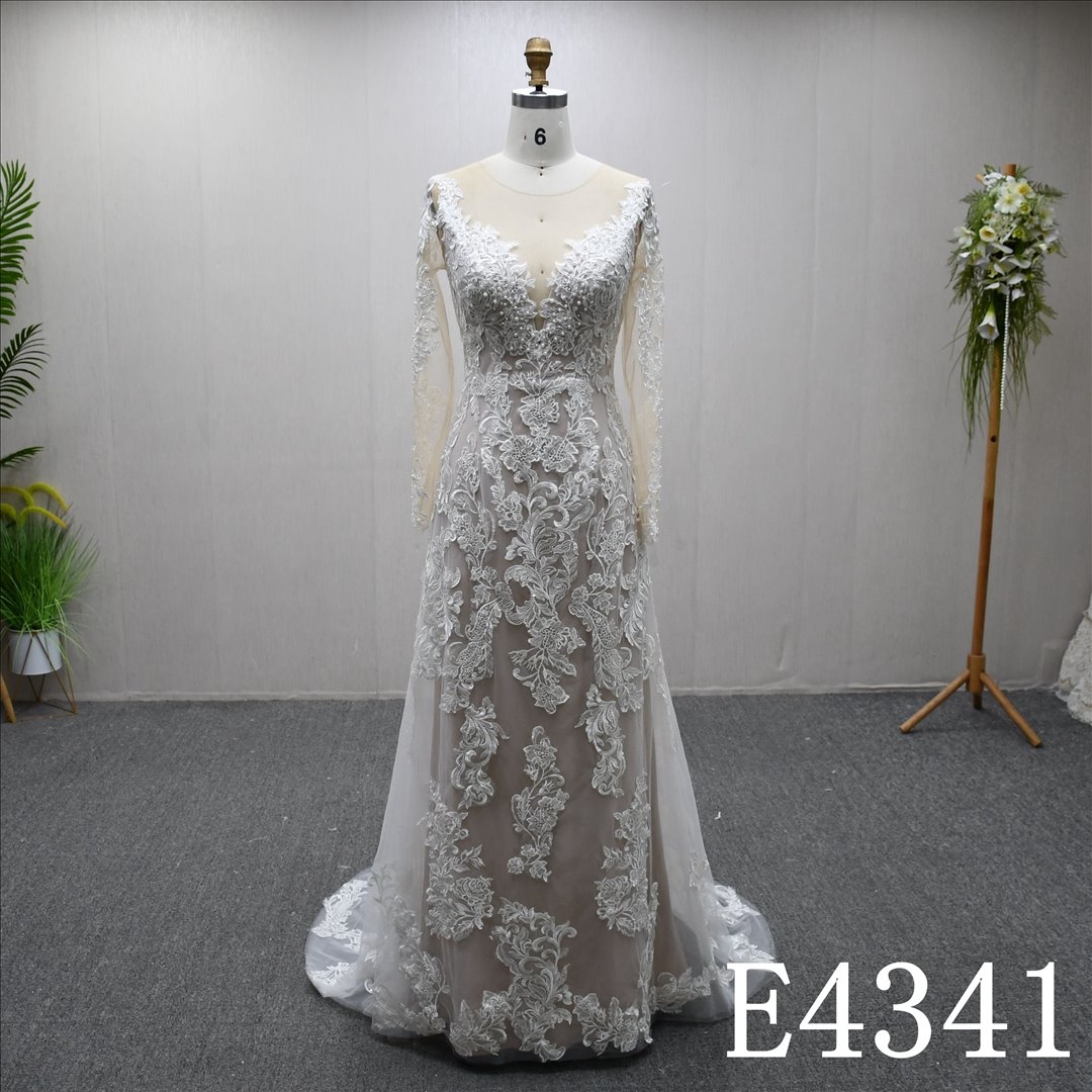 A beautiful A-line wedding evening gown with a full-body lace design