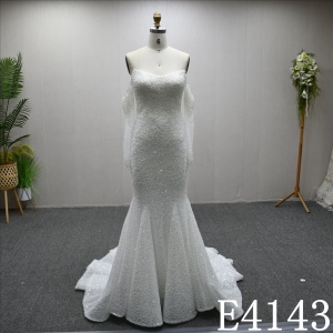 Unique and luxurious design, V-neck, pearl-embellished wedding dress with a detachable train