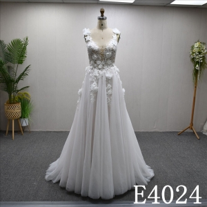 An A-line wedding dress with a luxurious lace design and a zipper and buttons at the back.