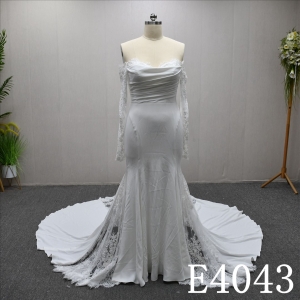 Mermaid wedding gown with a unique sweetheart neckline and lace embellishments