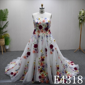 A gorgeous and unique Ivory and Colorful A-line wedding dress evening gown, adorned with lace flowers.